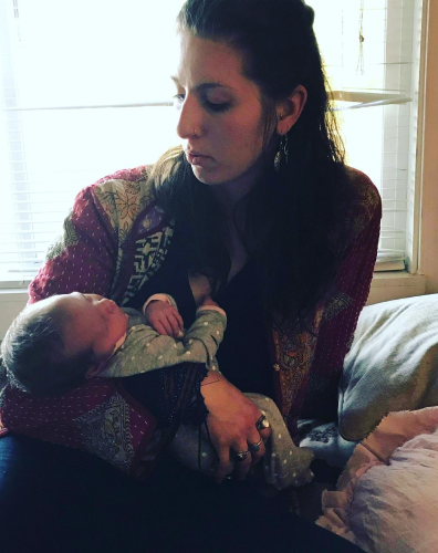 Picture of Faith holding a baby, lovingly